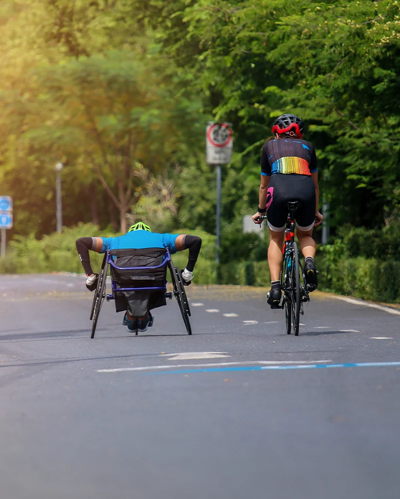 Tour de Big Bear adaptive road rider racing with support